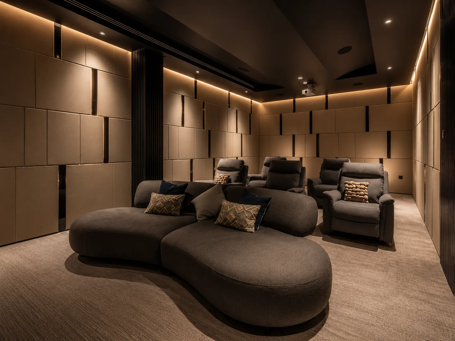 Home cinema — plush seating in a single pool of warm light, deep-toned acoustic walls, screen glowing